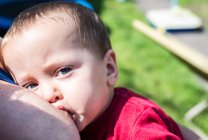 Baby boy breast feeding — Stock Photo