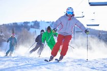 Male and female skiers — Stock Photo