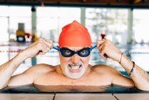 Man pulling mean face wearing goggles — Stock Photo