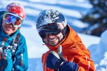 Male and female skiers — Stock Photo