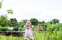 Cute Baby at allotment — Stock Photo
