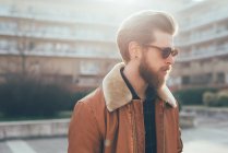 Hipster on housing estate — стоковое фото