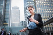 Businesswoman using mobile phone — Stock Photo