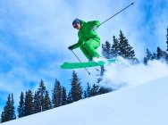 Man jumping while skiing — Stock Photo