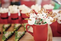Christmas lollipops and christmas tree biscuits — Stock Photo