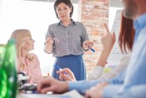 Businesswoman leading business meeting — Stock Photo