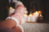 Feet of woman wearing festive socks — Stock Photo