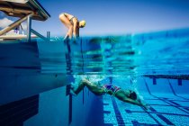 Swimmer on diving board — Stock Photo