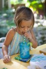 Girl drinking ice water — Stock Photo