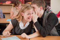 Two students share a secret — Stock Photo
