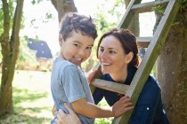 Mother and son playing with ladder — Stock Photo