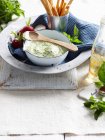 Herb dip and breadsticks — Stock Photo