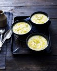 Bowls of soup with olive oil — Stock Photo