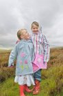 Two girls standing in moorlands — Stock Photo