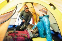 Couple packing in tent — Stock Photo