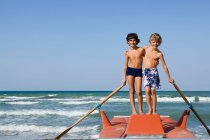 Two young boys on nautical vessel — Stock Photo