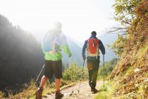 Two men hiking in mountains — Stock Photo