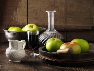 Apples with decanter of port — Stock Photo
