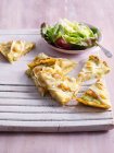 Sliced quiche with salad — Stock Photo