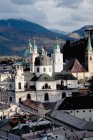 Salzburg cathedral overlooking rooftops — Stock Photo
