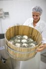 Worker at a cheese dairy — Stock Photo