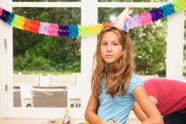 Girl wearing hat at birthday party — Stock Photo