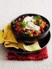 Bowl of chili with corn chips — Stock Photo