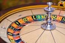 Casino roulette wheel in motion — Stock Photo
