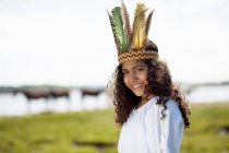 Girl wearing Native American costume — Stock Photo