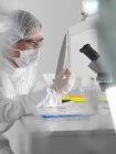 Forensic scientist with evidence — Stock Photo