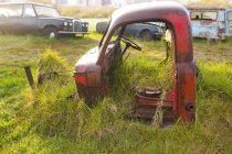 Vintage car in scrap yard — Stock Photo