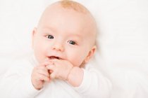 Baby smiling into camera — Stock Photo