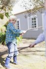 Children playing with sticks outdoors — Stock Photo