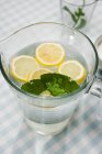 Pitcher of lemon water — Stock Photo