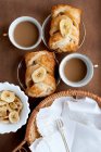 Baked pastries with banana and coffee — Stock Photo