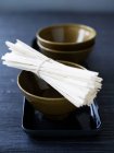 Dry gooksu noodles with bowls — Stock Photo