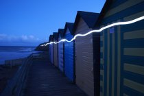 Row of colourful beach huts — Stock Photo