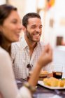 Friends talking at dinner — Stock Photo
