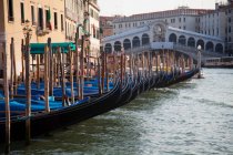 Gondolas docked on canal — Stock Photo