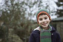 Portrait of boy in knit hat outdoors — Stock Photo