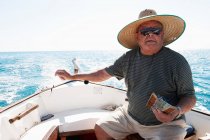 Fisherman at sea in fishing boat — Stock Photo