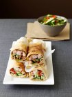Chicken vegetable rolls and salad in bowl — Stock Photo
