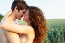 Topless couple, holding each other — Stock Photo