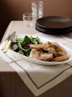 Plate of guinea fowl and salad — Stock Photo
