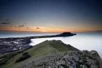 Vista de Worms Head at sunset, Rhossili bay, Gower, País de Gales — Fotografia de Stock