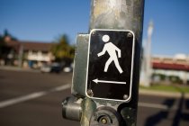 Pedestrian crossing sign with button — Stock Photo