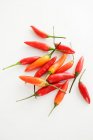 Fresh chillies on white — Stock Photo