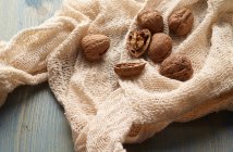 Walnuts in knitted fabric — Stock Photo