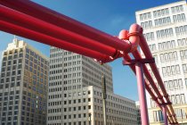Red pipes in city center — Stock Photo