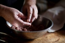 Hands forming meatball — Stock Photo